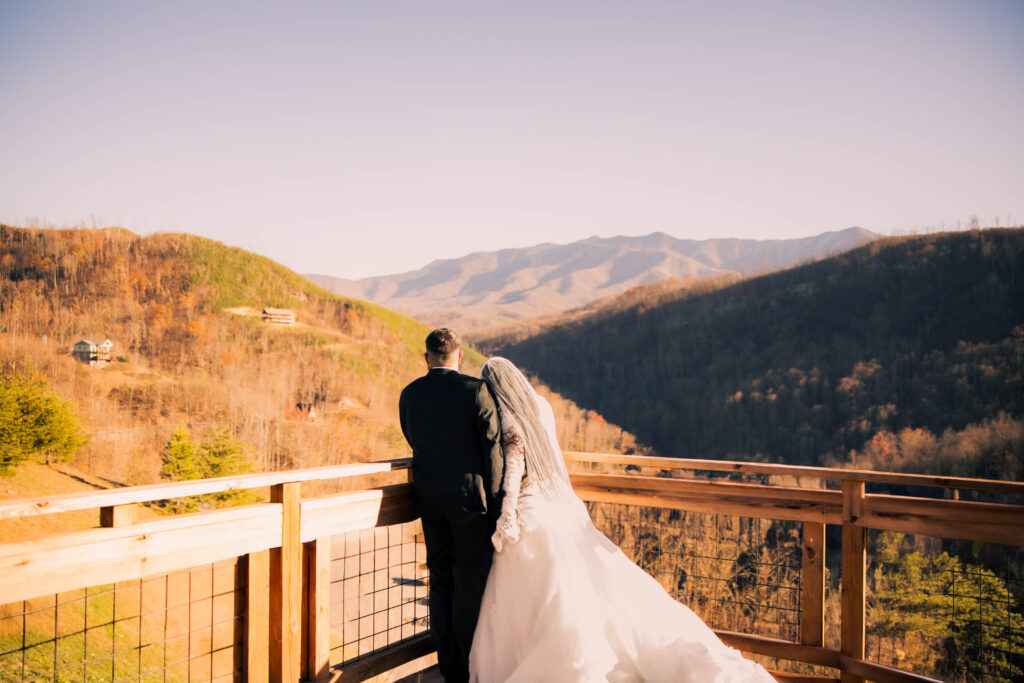 Bride and groom sharing a quiet moment overlooking the Smoky Mountain views during their full-day elopement in Gatlinburg.