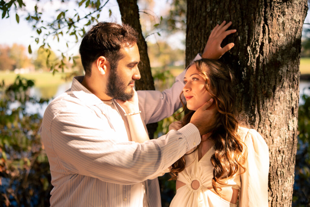 Couple sharing an intimate moment during an outdoor elopement in Illinois surrounded by trees and warm natural light