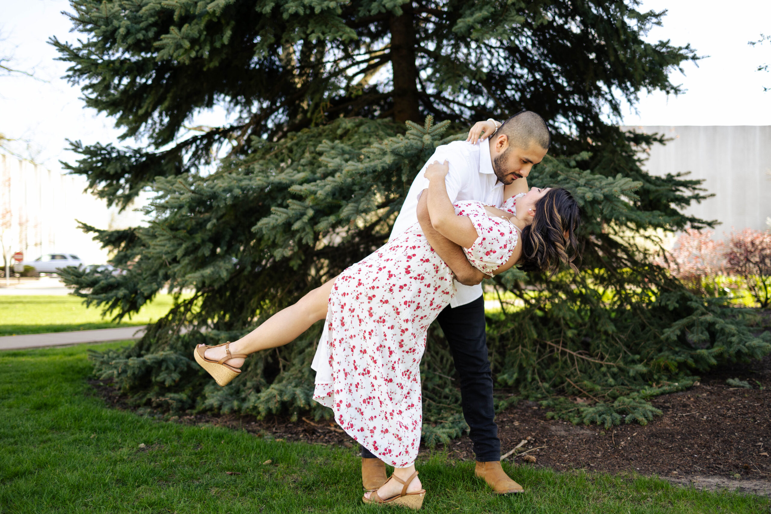 Couple embracing during an intimate Davenport elopement surrounded by greenery and trees